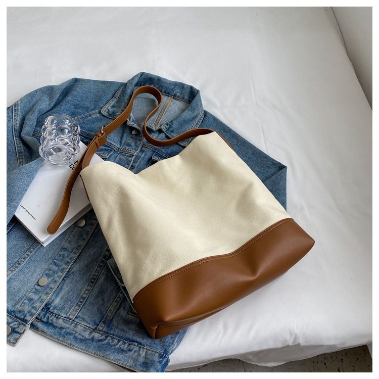 Casual Large Capacity For Women 2025 New Fashion Canvas Shoulder Textured Bucket Versatile Commuter Tote Bag_voghion.com