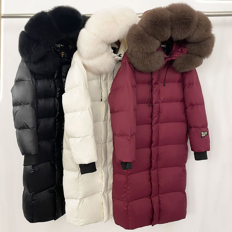 Abbigliamento da donna Giacca lunga con cappuccio e finiture in pelliccia di volpe, 90% piumino d'oca, nylon impermeabile, elegante e caldo cappotto invernale_voghion.com