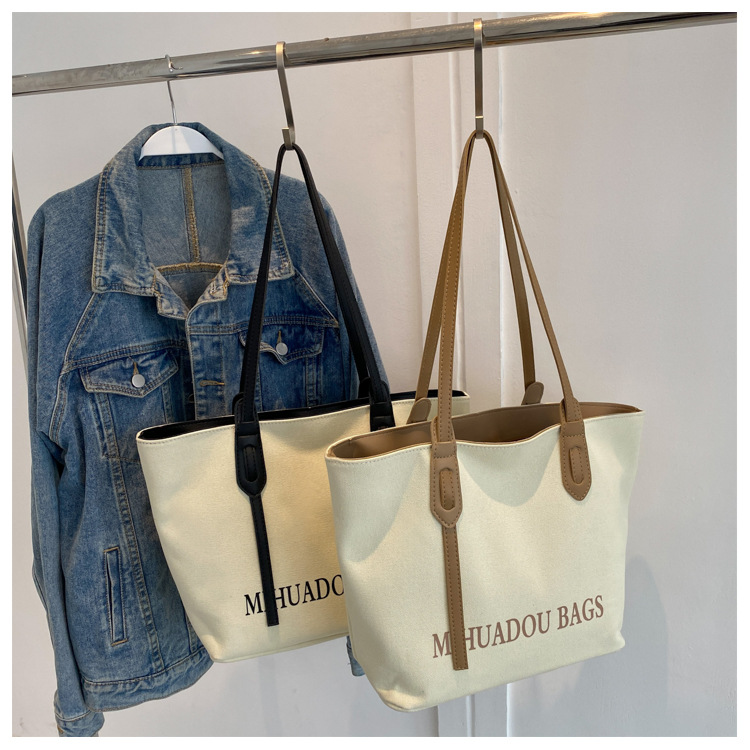 Canvas Große Damen 2023 Neue Mode Pendler Umhängetasche Einfarbig Brief Stil Urban Einfache Einkaufstasche_voghion.com