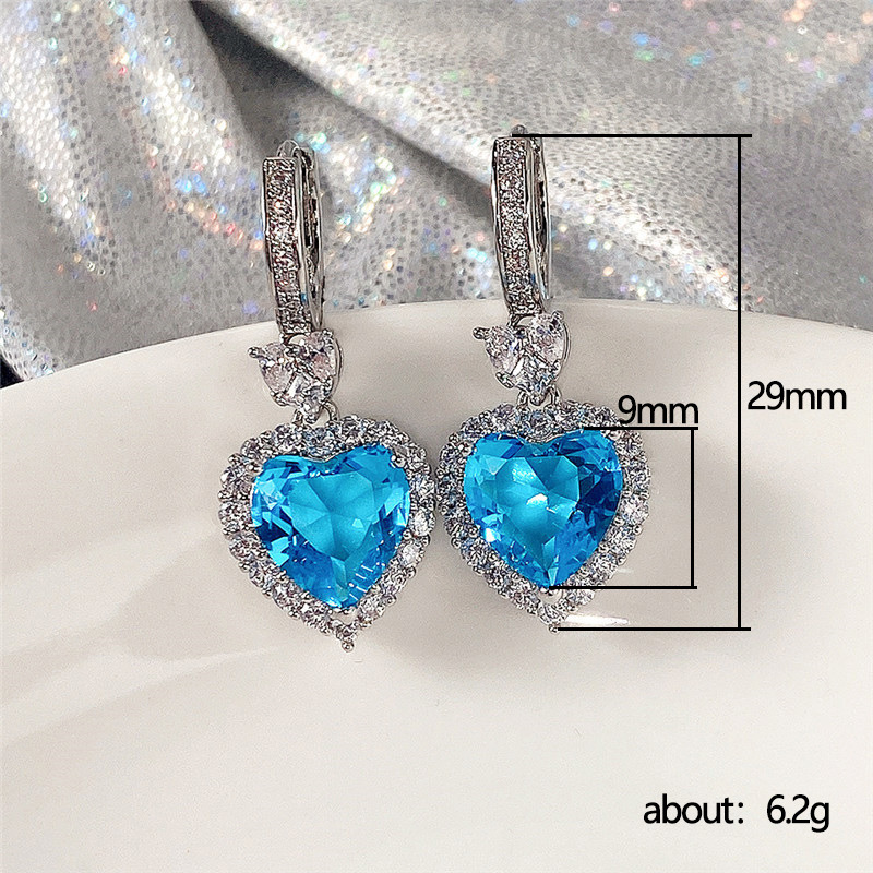 Conjunto de pendientes y anillo con colgante de corazón de océano con circonita azul topacio de nueva tendencia de Cao Shi Live para mujer_voghion.com
