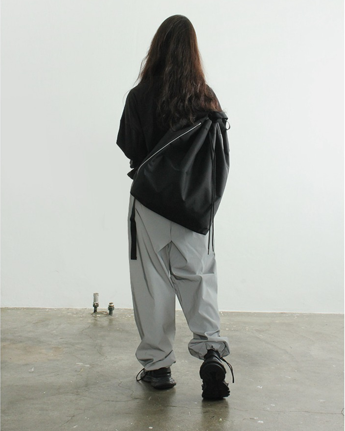 Versione coreana in nylon da strada stile casual con doppia spalla e coulisse, borsa a secchiello con fibbia laterale bianca_voghion.com