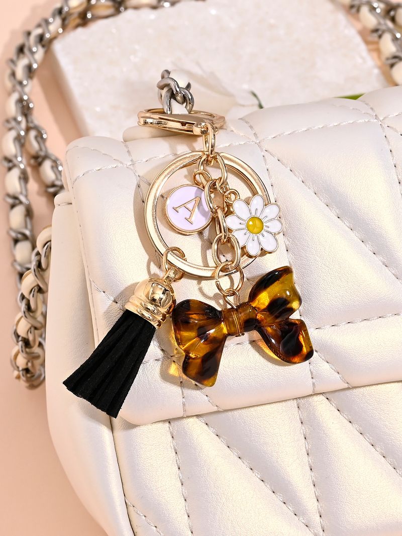 Porte-clés avec pompon et nœud papillon imprimé léopard, nouvelle mode, mignon, pendentif pour sac_voghion.com