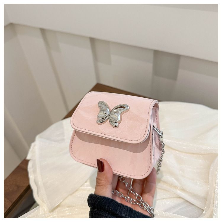 Borsa a tracolla con catena elegante e versatile, modello coreano, per donne, modello Ins Niche, di fascia alta, modello 2024, con auricolari e rossetto._voghion.com