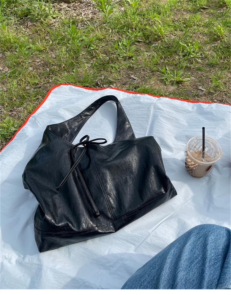 Versione coreana della borsa da donna in pelle con fiocco, stile pigro, borsa a tracolla da ascella, nuovi modelli alla moda per la primavera e l'estate 2025_voghion.com