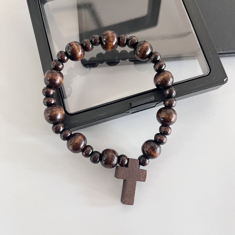 Bracelet élastique fait main en perles de bois noires et croix pour femmes et hommes_voghion.com