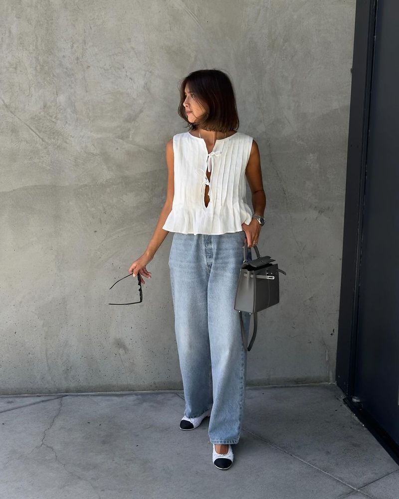 Completo da donna europeo e americano, primavera ed estate 2025, in cotone e lino, senza maniche, due pezzi, con camicia e gonna lunga da donna con spalline sottili._voghion.com