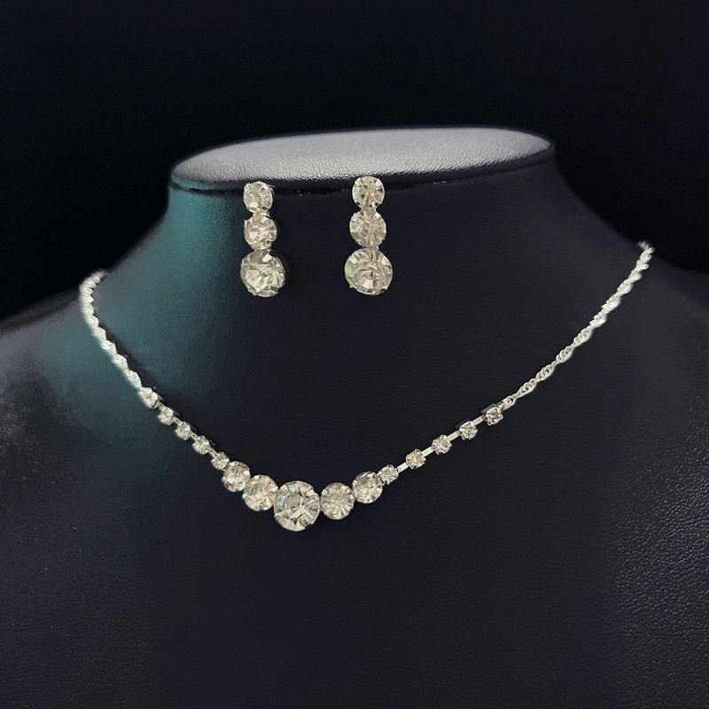 Set di gioielli da donna: elegante collana, orecchini, bracciale e spilla con strass per donna, perfetti per feste serali, matrimoni e occasioni speciali_voghion.com