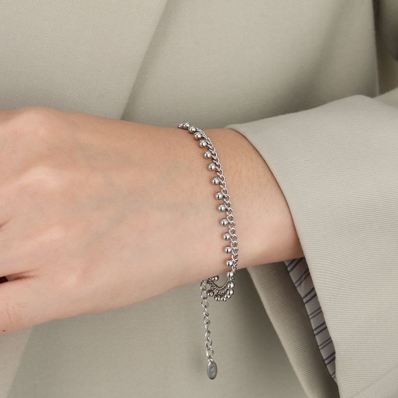 Bracciale con perline rotonde esagerate in stile esotico alla moda per donna con design a nappa, gioielli in acciaio al titanio_voghion.com