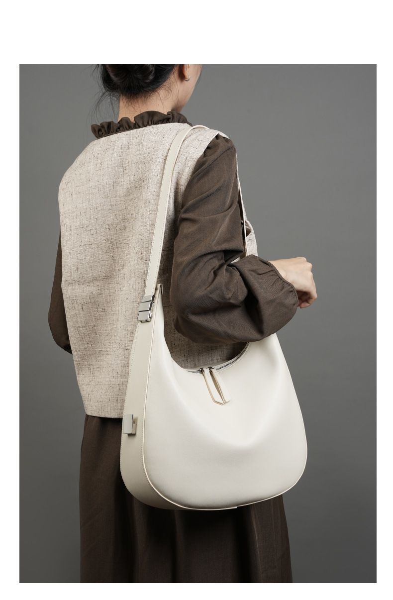 Borsa a tracolla da donna in vera pelle di vacchetta, modello a mezzaluna, con design primaverile ed estivo._voghion.com