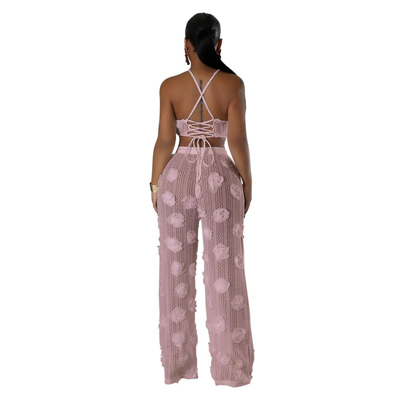 Completo due pezzi in tinta unita con top corto e pantaloni larghi e aderenti da donna_voghion.com