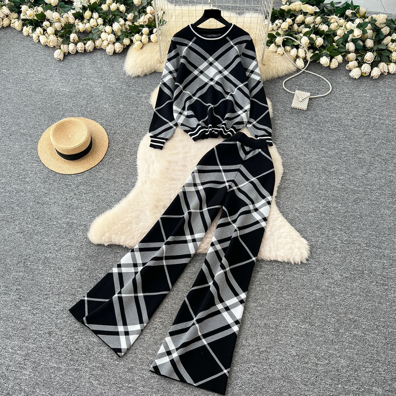 Elegante outfit da donna per autunno inverno: maglione stampato alla moda con pantaloni larghi a vita alta, set coordinato casual ed elegante._voghion.com