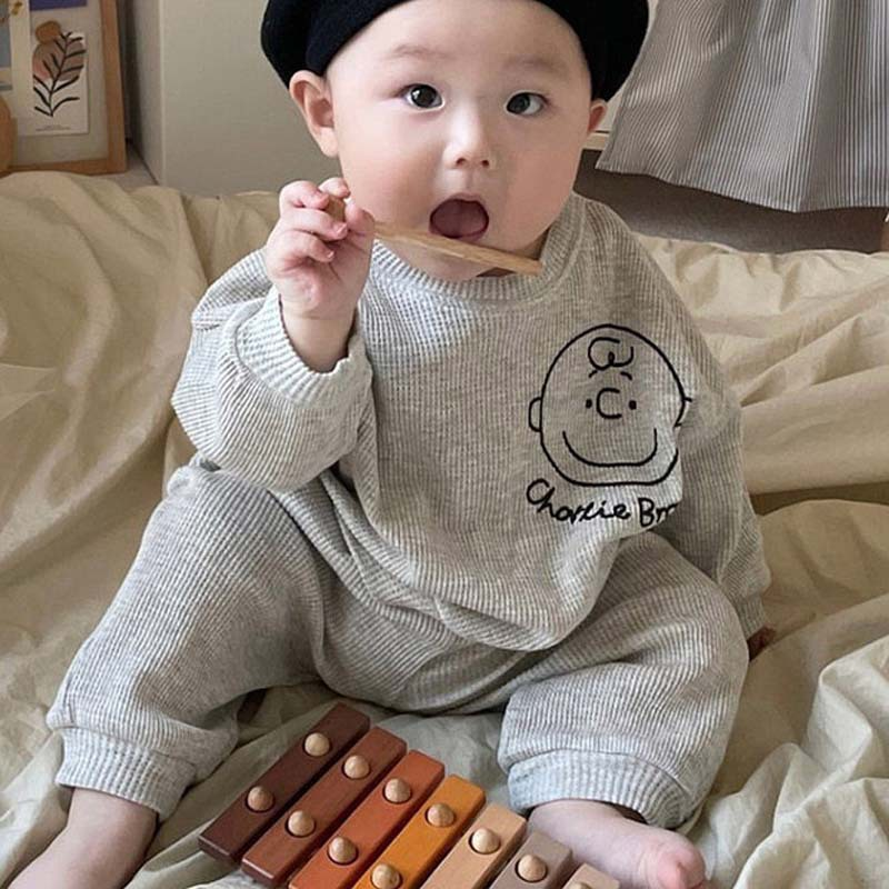 Vêtements pour enfants coréens bébé trésor automne nouveau graffiti dessin animé tête humaine pull pantalon ensemble deux pièces_voghion.com