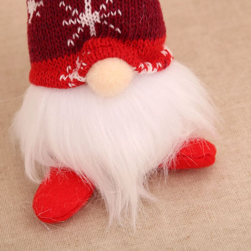 Adorno navideño de peluche con forma de estrella y copo de nieve a rayas LED, color rojo, verde y gris, sentado y con patas largas._voghion.com