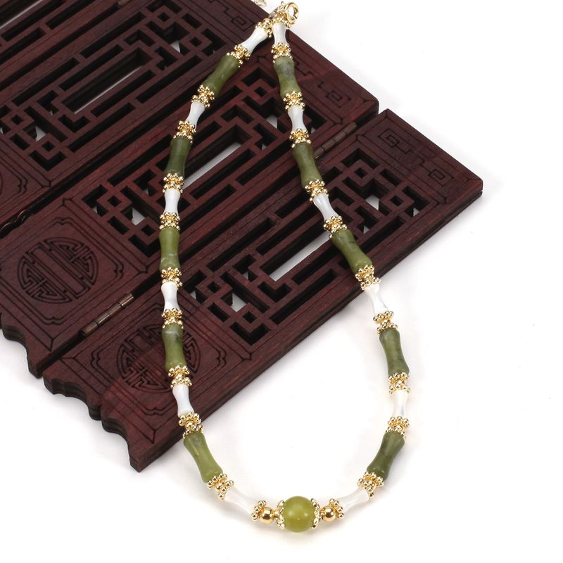 Set di collana con bracciale in pietra naturale con perline rotonde in conchiglia di peridoto di bambù regolabile da donna_voghion.com
