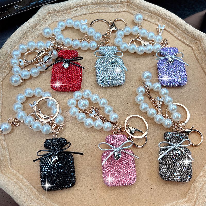 Koreanische Version Neue Intarsien Diamant Bogen Keychain Perle Farbverlauf Parfüm Flasche Tasche Mode Anhänger_voghion.com