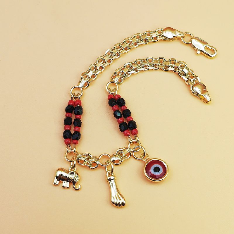 Braccialetto in stile bohémien con perline rosse e nere, con occhio malvagio, placcato in rame con oro 14 carati_voghion.com