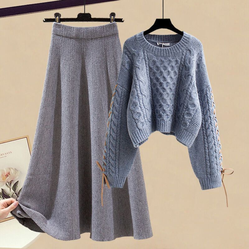 Completo da donna con maglione lavorato a maglia e gonna midi: outfit autunno-inverno alla moda, elegante e snellente in due pezzi_voghion.com