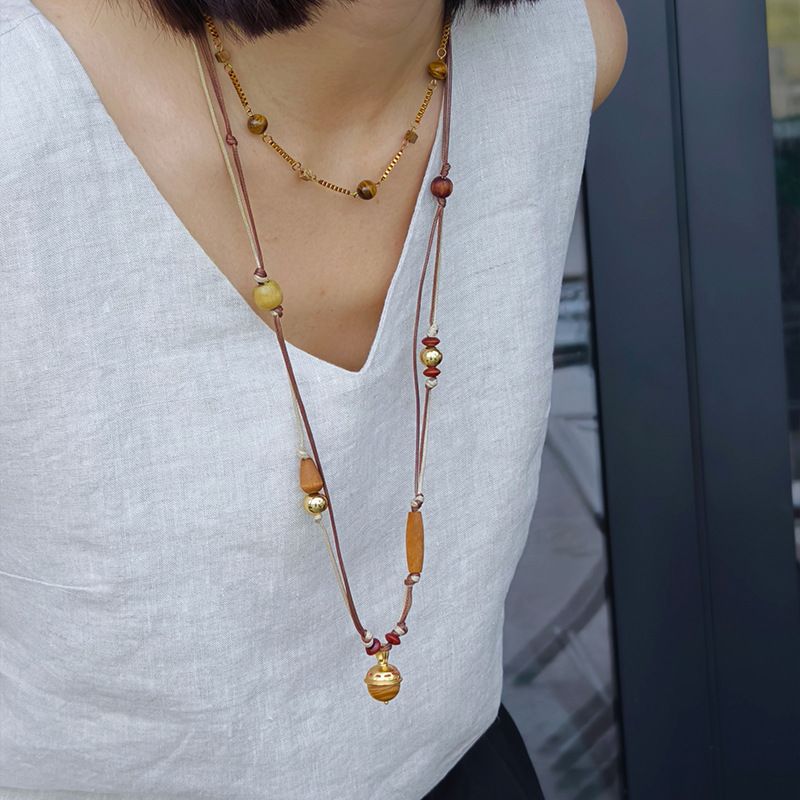 Collana con ciondolo a campana multistrato con perline di legno, corda di cera, stile etnico, design di nicchia, gioielli di senso per_voghion.com