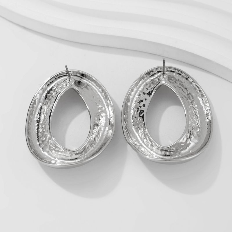 Personality metal geometric texture hollow earrings female irregular twisted glossy earrings earrings_voghion.com