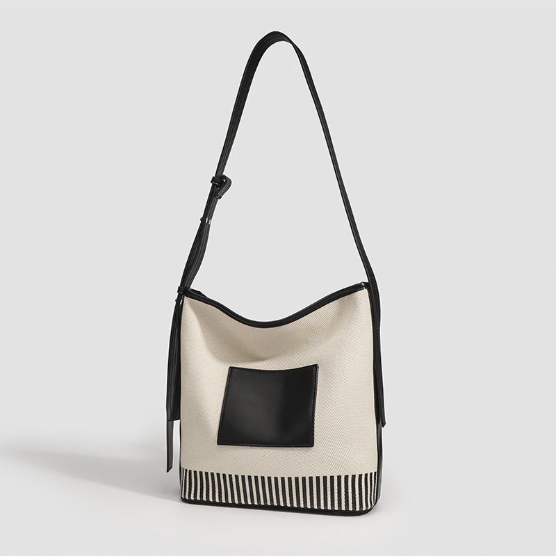 Tassen 2025 Nieuwe niche canvas splitsen grote capaciteit emmer brede band modieuze honderd strepen schoudertas_voghion.com