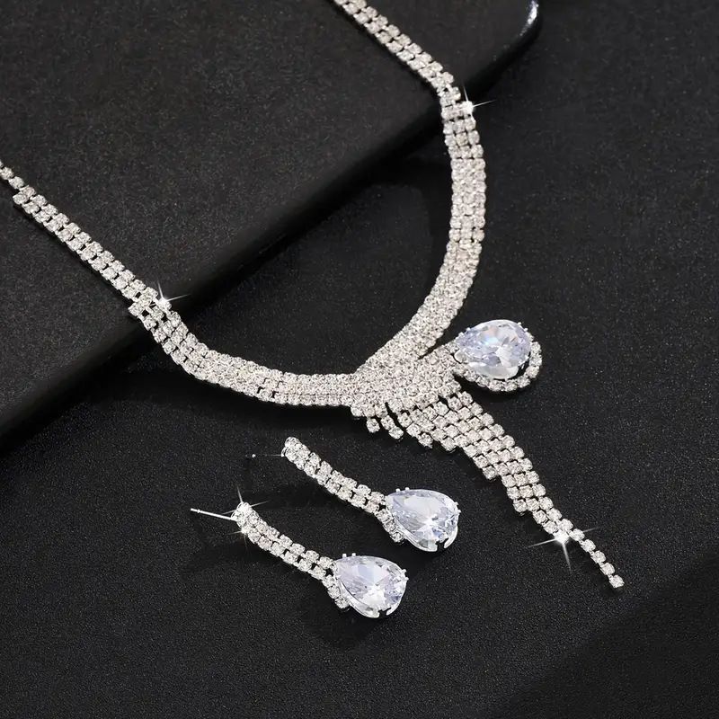 Collana orecchini bracciale con zirconi a goccia intarsiati di lusso e borsa da sera lucida, abito da banchetto in quattro pezzi_voghion.com