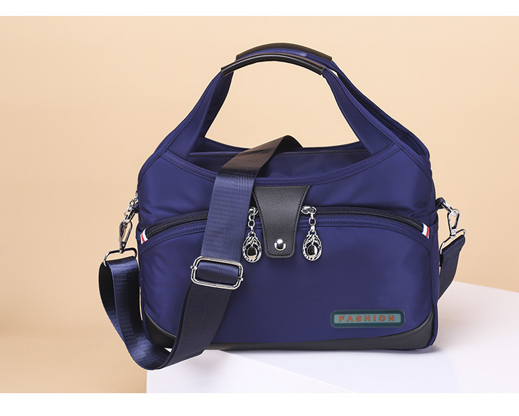 Modern och lätt Oxfordtyg Koreansk version Dam Casual Stor Kapacitet Vattentät Rese Shopping Handhållen Axelväska Crossbody_voghion.com
