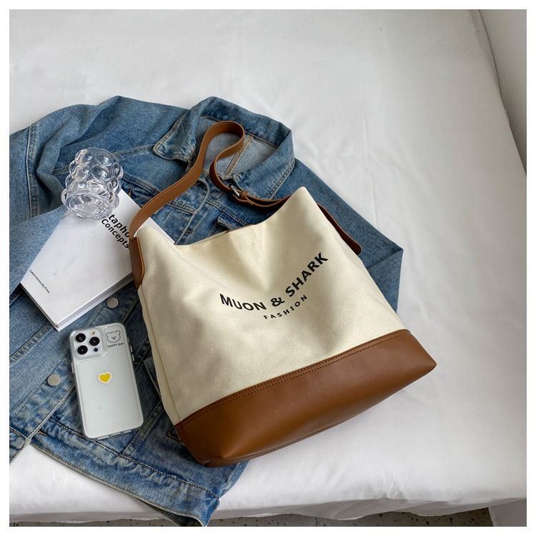 Casual Large Capacity For Women 2025 New Fashion Canvas Shoulder Textured Bucket Versatile Commuter Tote Bag_voghion.com