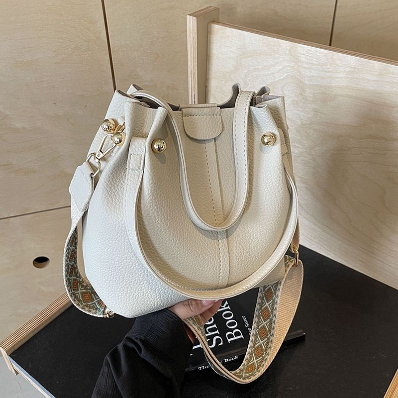 Borsa a secchiello versatile di alta qualità in stile coreano, primavera estate 2024, nuova borsa a tracolla con tracolla larga da donna_voghion.com