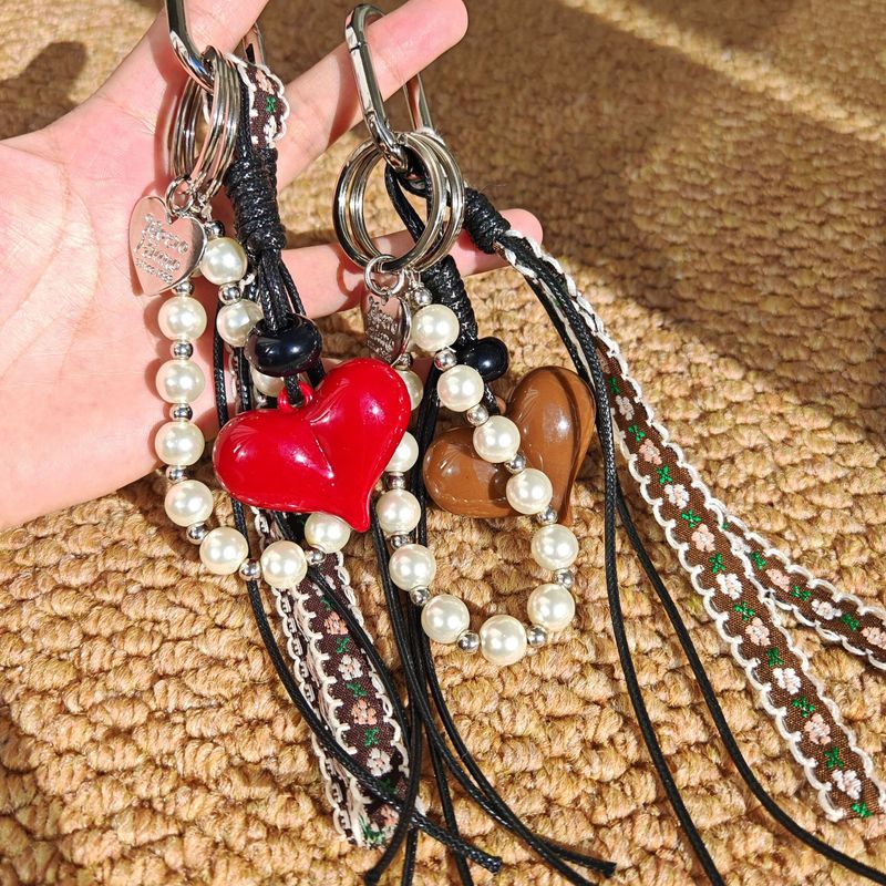 Ciondolo per borsa a forma di cuore con catena di perle, portachiavi, cinturino intrecciato, corda intrecciata_voghion.com