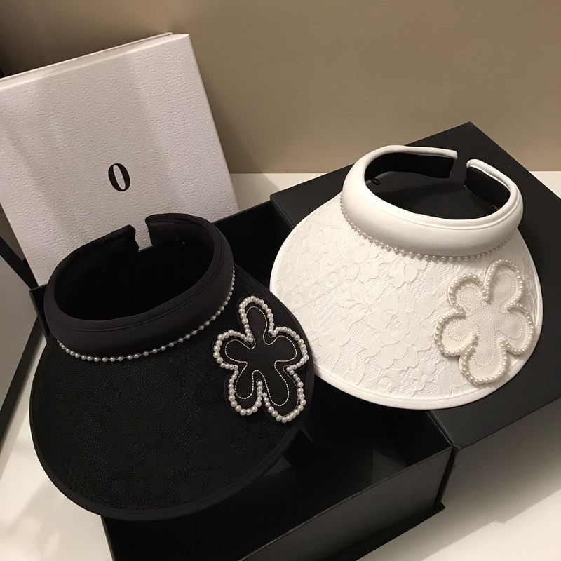 Top vuoto in stile forcina in pizzo jacquard coreano per viaggi estivi, parasole leggero con fiori di perle che riduce l'età e sole_voghion.com