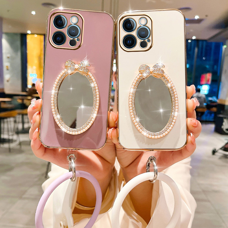 Custodia a specchio ovale con fiocco per Samsung A05S A73 A21S A34 A12 A54 A25 A33 A24 A32 5G A23 A53 A13 4G A14 A04S Braccialetto da polso_voghion.com