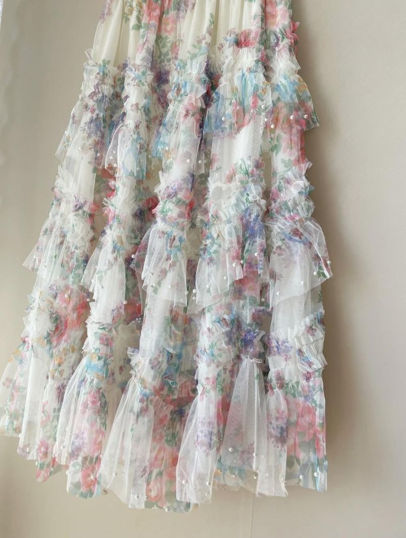 Conjunto de saia em camadas de malha com estampa floral boho, acabamento em renda e blusa de malha com miçangas, roupa cottagecore de verão_voghion.com