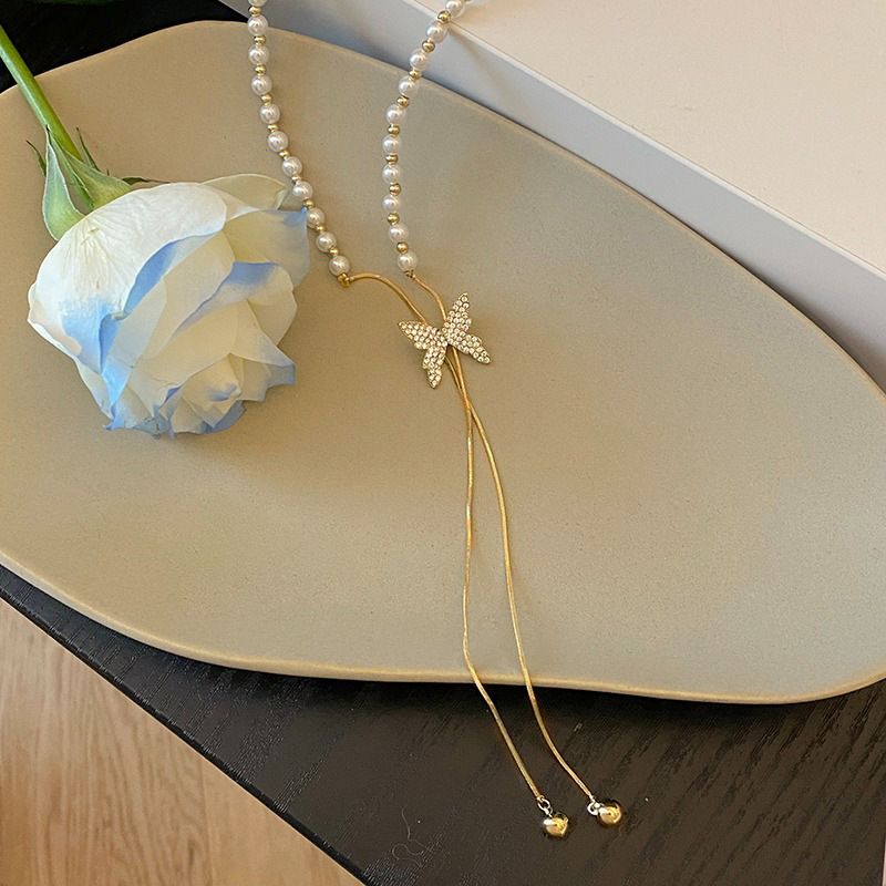 Pearl necklace for women, necklace design, niche butterfly tassel pendant, clavicle chain 2023 new_voghion.com