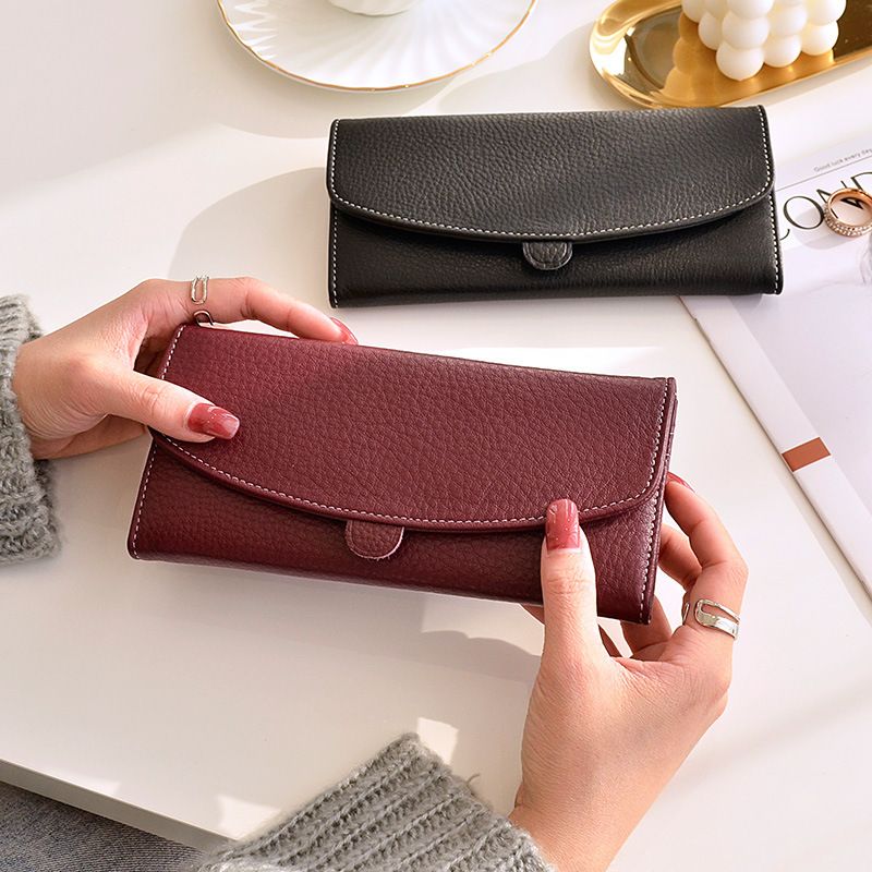 Portafoglio da donna in vera pelle, lungo e di grande capacità, con scomparti per carte di credito e chiusura a zip._voghion.com