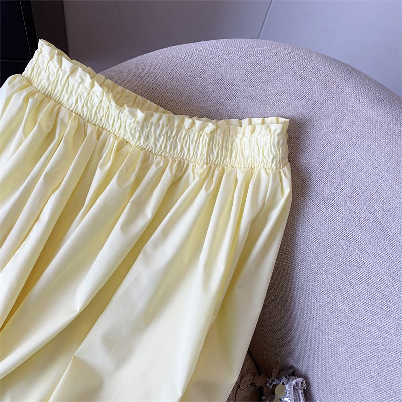 Gonna gialla da donna, a vita alta, a trapezio, sottile, di media lunghezza, con grande gonna a ombrello._voghion.com