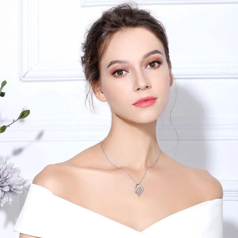 Ciondolo a forma di cuore in argento con fiore e girasole_voghion.com