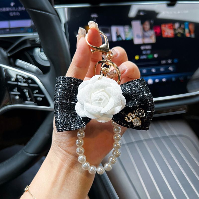Personalized pearl chain, small fragrance bow, camellia creative and exquisite car keychain, bag decoration, female_voghion.com