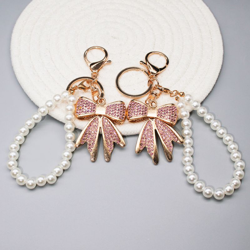 Diamantschleife Handykette Liebesschnalle Kopfhörerschale Dekorativer Anhänger Schmuck Schlüsselanhänger Anhänger_voghion.com