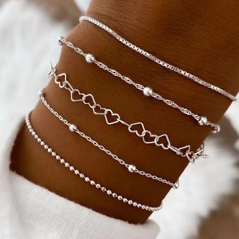 Perlenbesetzte mehrschichtige Reisperlen mit eingelegten Diamanten und fünfschichtigem Armbandset_voghion.com