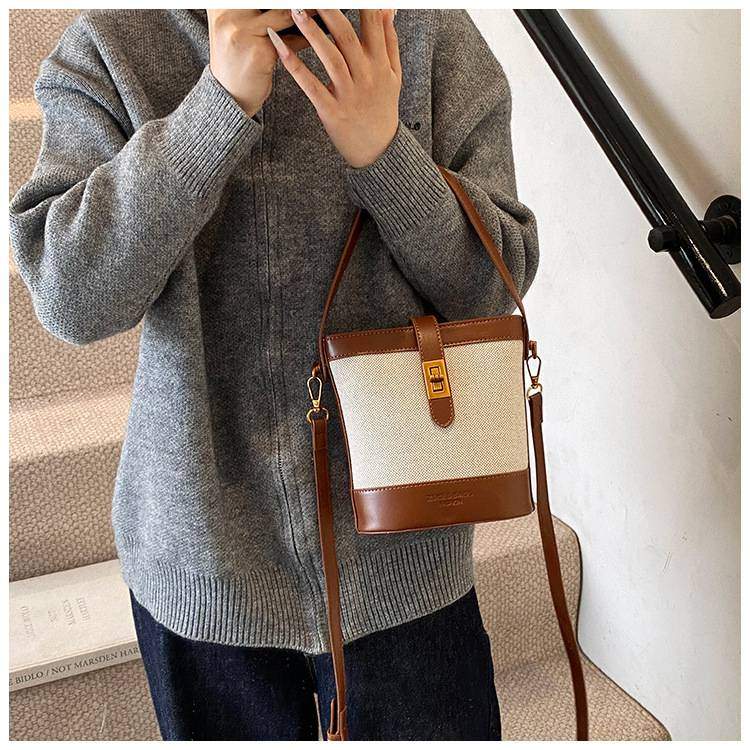 Borsa a secchiello da donna squisita per autunno e inverno, nuova e comoda da tenere a mano, con cuciture in tessuto dal senso avanzato e borsa a tracolla con colori a contrasto_voghion.com