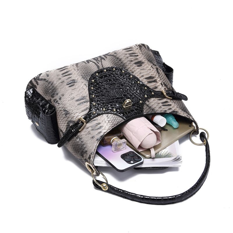 Borsa a mano con tracolla e motivo serpente, stile retrò, da donna_voghion.com