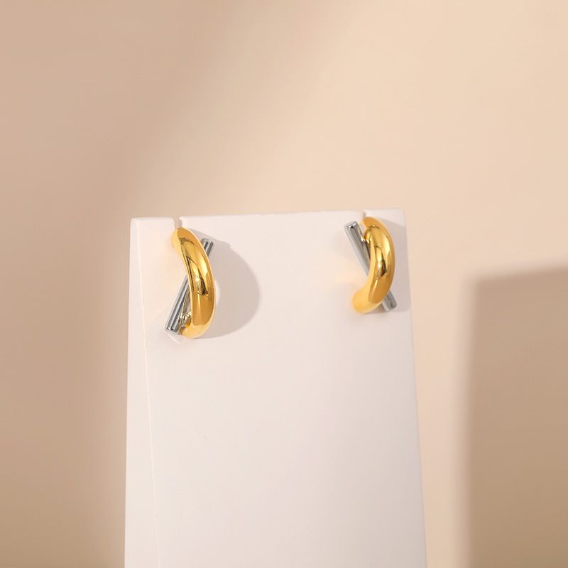 Gold and silver contrasting design personality earrings K real gold plated niche metal texture cross twist earrings_voghion.com
