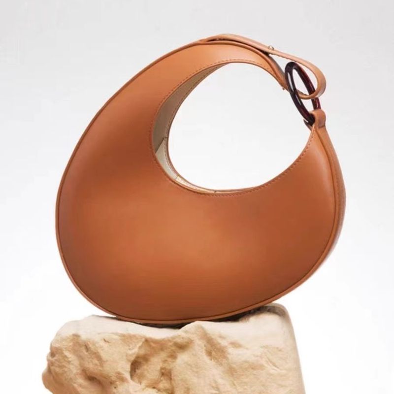 Bolso de hombro de diseño italiano de nicho 2024, moderno y único, con forma de media luna y gran capacidad._voghion.com