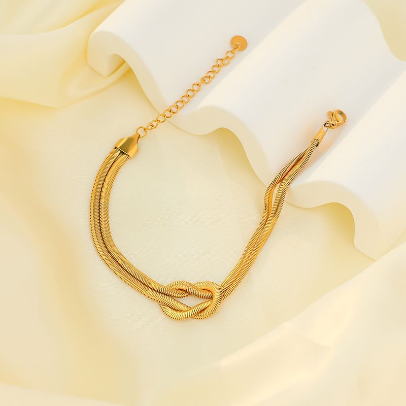 Bracciale da donna in acciaio al titanio con osso di serpente appiattito, collana in conchiglia dorata, placcato elettroliticamente e intarsiato con zirconi a quattro colori, set di braccialetti personalizzati_voghion.com