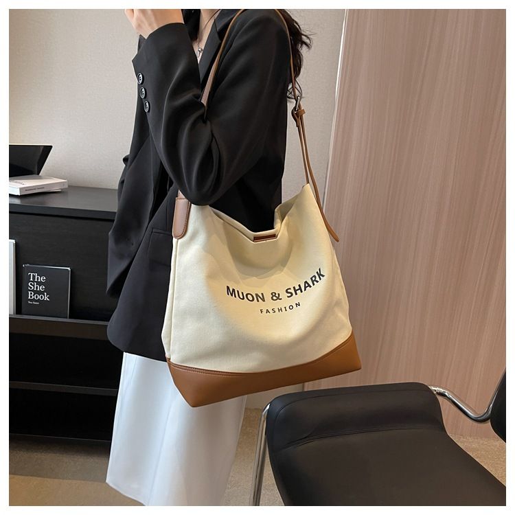 Casual Large Capacity For Women 2025 New Fashion Canvas Shoulder Textured Bucket Versatile Commuter Tote Bag_voghion.com