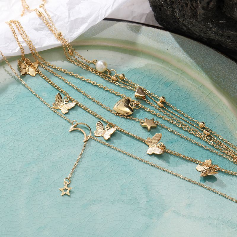 Hot selling alloy set, creative and personalized multi-layer butterfly pendant, 6 pieces of moon peach heart necklace_voghion.com