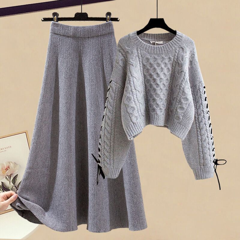 Completo da donna con maglione lavorato a maglia e gonna midi: outfit autunno-inverno alla moda, elegante e snellente in due pezzi_voghion.com