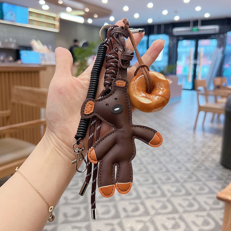 Neuer einfacher Brotleder-Schlüsselanhänger mit handgewebtem Seil, Nischen-Teddybär, süßer, entzückender Taschendekorationsanhänger_voghion.com