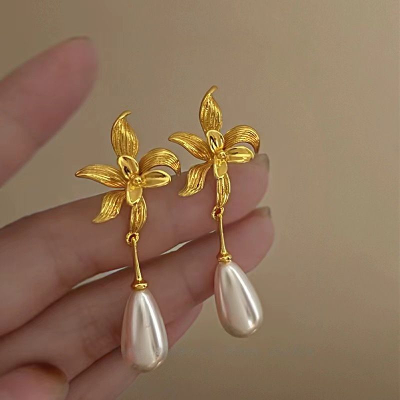 Nappa con fiore scavato con ago d'argento, alla moda, personalizzata, stile fresco e distaccato, lunga, elegante e di alta qualità._voghion.com