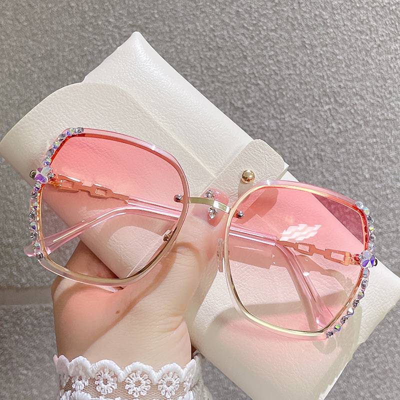 Korean version of new frameless metal sunglasses with personalized cut edge glasses, fashionable large frame and diamond inlaid women's sunglasses_voghion.com